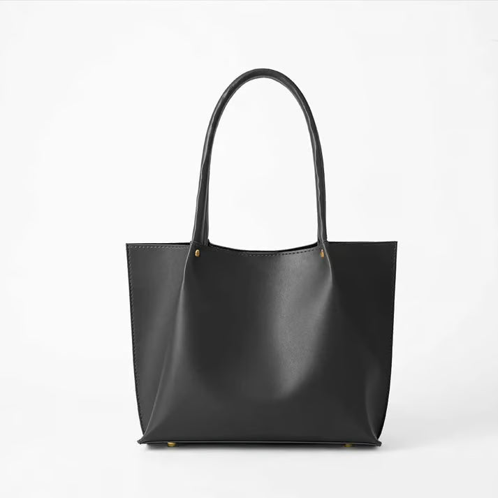 Classic black leather tote bag with dual handles for everyday carry
